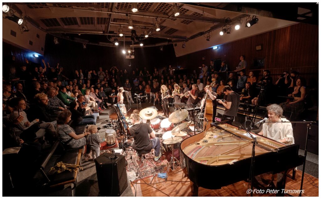 Band playing in a packed hall